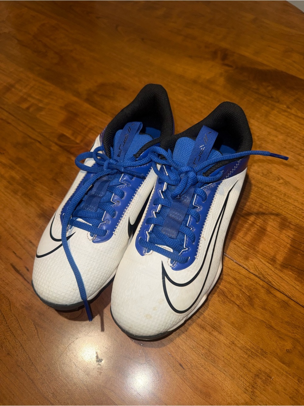 Kids White and Blue Nike Cleats